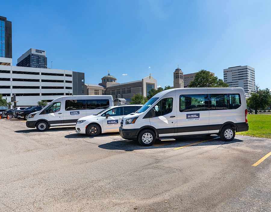 METRO Vanpool vehicles parked in downtown Houston.